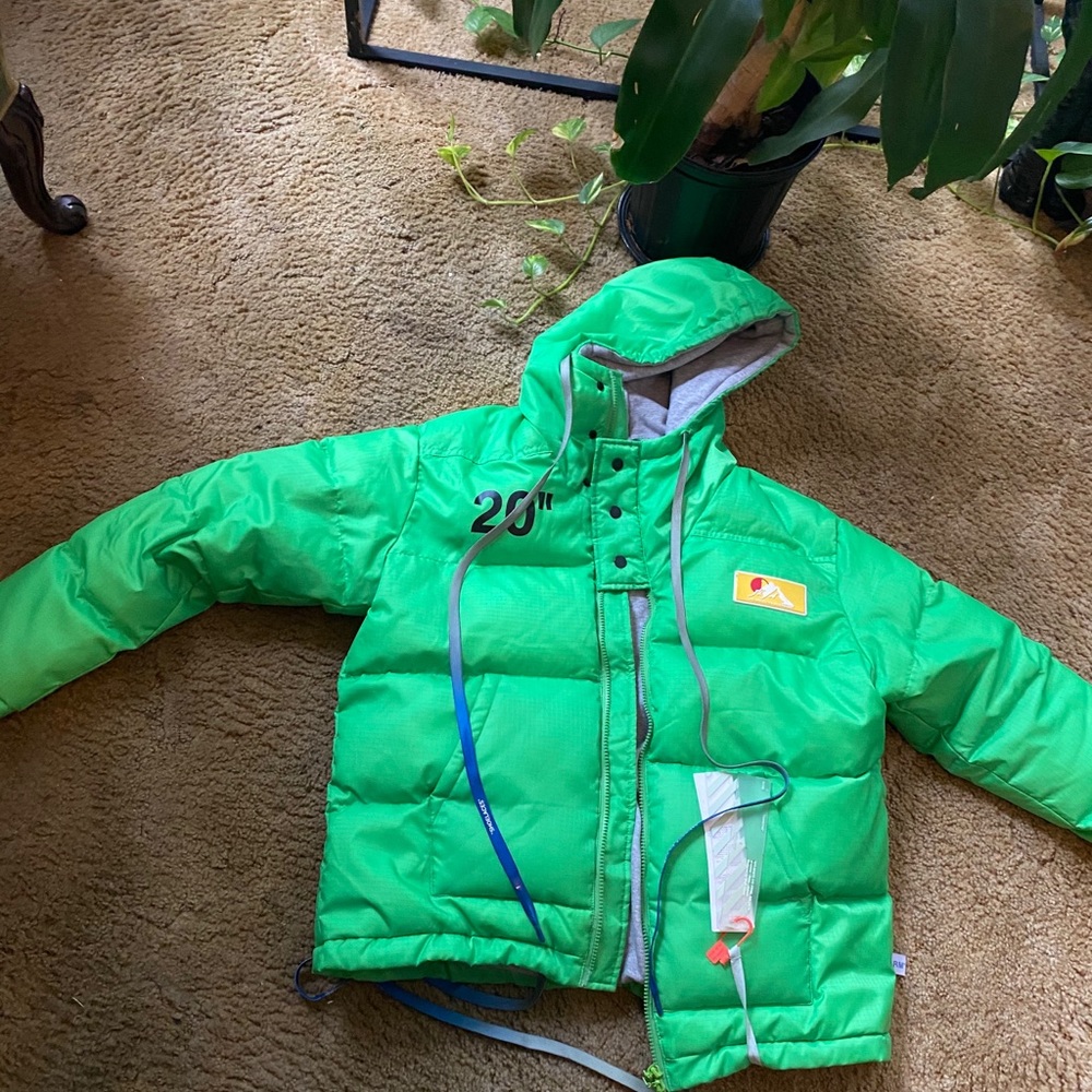 Off white jacket bright green flashy cool jacket everything works zipper works.